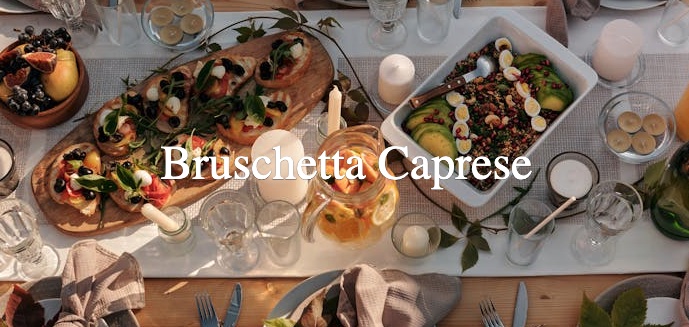 An image of table full of food set for many guests, upon which is written "Bruschetta Caprese"