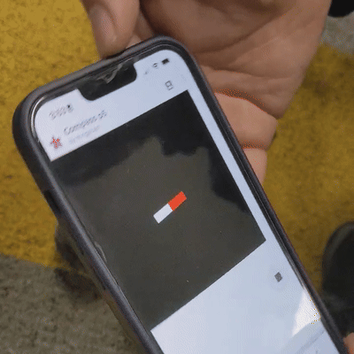 A phone being rotated while the compass needle on the screen stays oriented in one direction.