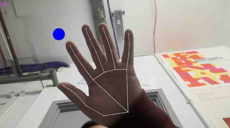 A hand with lines drawn over it indicating a computer is tracking the hands location